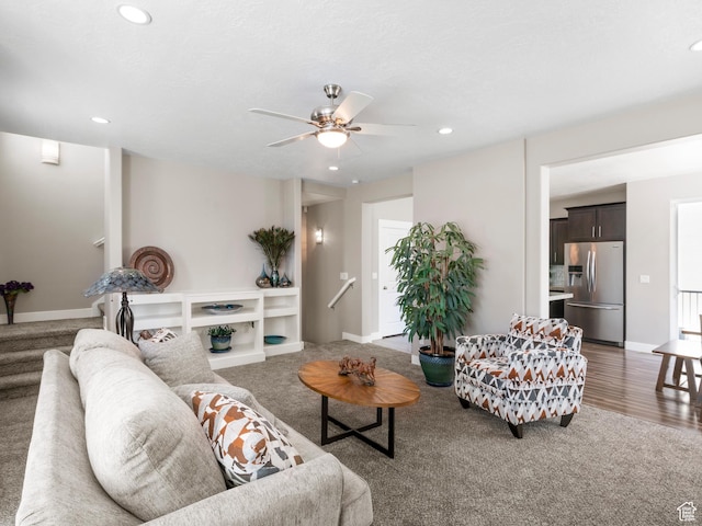 living area with carpet floors, a ceiling fan, recessed lighting, and baseboards