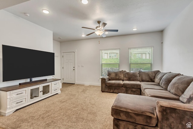 living room with ceiling fan, light colored carpet, baseboards, and recessed lighting