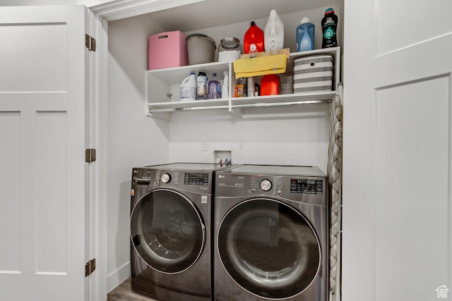 washroom featuring independent washer and dryer, wood finished floors, and baseboards