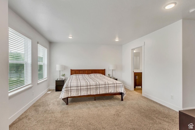 bedroom with carpet, baseboards, and recessed lighting