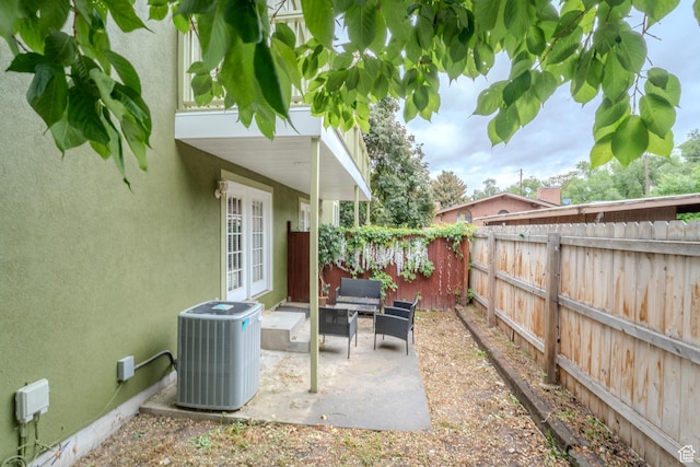 1140 E Elgin Ave S, Millcreek, UT 84106 - view of patio with cooling unit, a fenced backyard, and french doors