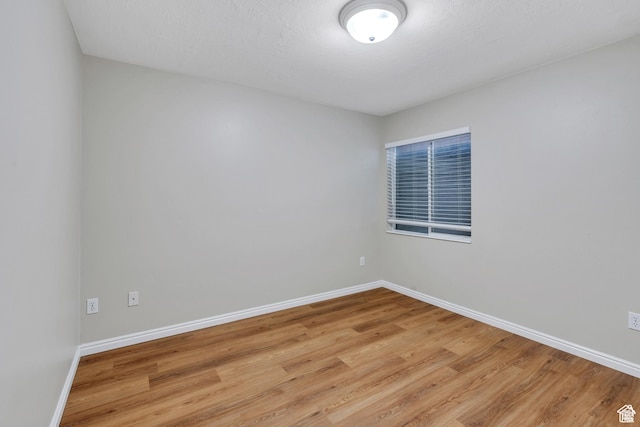 1140 E Elgin Ave S, Millcreek, UT 84106 - empty room featuring light wood finished floors and baseboards