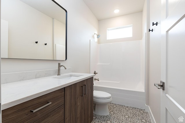 bathroom featuring toilet, vanity, washtub / shower combination, tile patterned floors, and recessed lighting