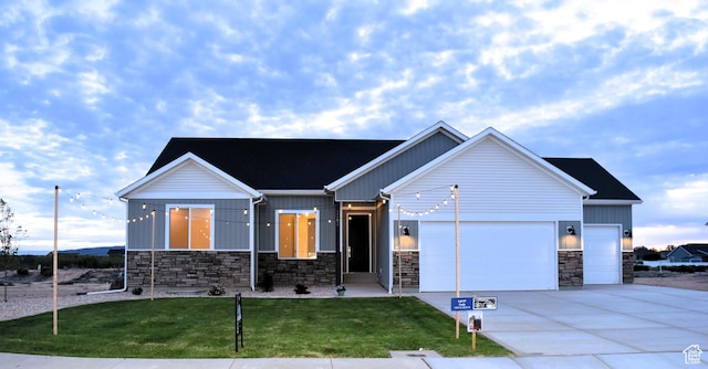 1263 N 3625 W Cir W, Cedar City, UT 84721 - view of front facade with an attached garage, stone siding, board and batten siding, driveway, and a front yard