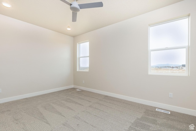 spare room featuring a ceiling fan, carpet, baseboards, and recessed lighting