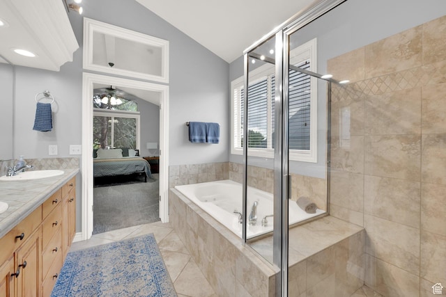ensuite bathroom with vaulted ceiling, double vanity, a bath, a stall shower, and tile patterned floors