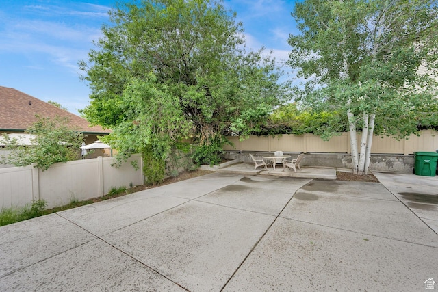 view of patio featuring outdoor dining area and a fenced backyard
