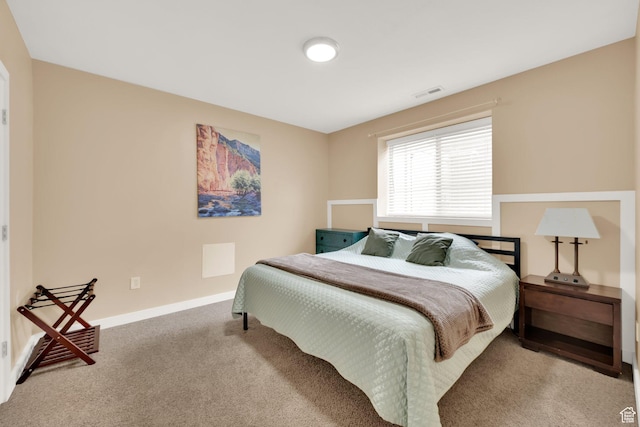 bedroom featuring carpet floors and baseboards