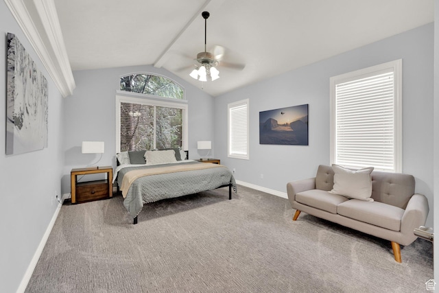 carpeted bedroom with vaulted ceiling, baseboards, and ceiling fan