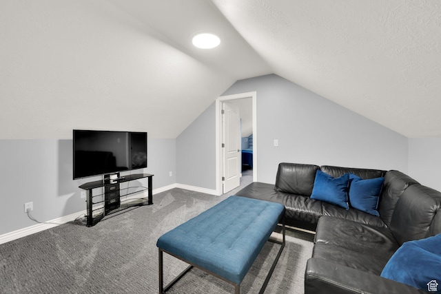 living area featuring vaulted ceiling, carpet floors, baseboards, and a textured ceiling