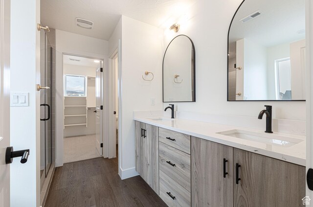 1262 N 3625 W Cir W, Cedar City, UT 84721 - full bath with wood finished floors, double vanity, a stall shower, and baseboards