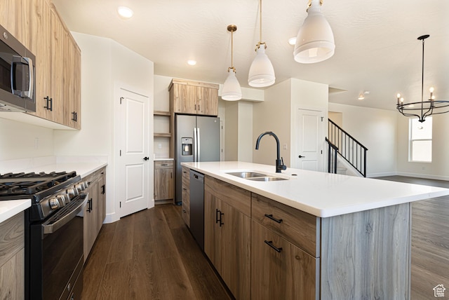 1262 N 3625 W Cir W, Cedar City, UT 84721 - kitchen with stainless steel appliances, a sink, dark wood-style floors, an island with sink, and light countertops