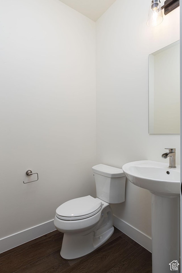 1262 N 3625 W Cir W, Cedar City, UT 84721 - half bathroom with baseboards, toilet, wood finished floors, and a sink