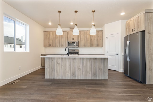 1262 N 3625 W Cir W, Cedar City, UT 84721 - kitchen with appliances with stainless steel finishes, light brown cabinets, light countertops, a kitchen island with sink, and recessed lighting