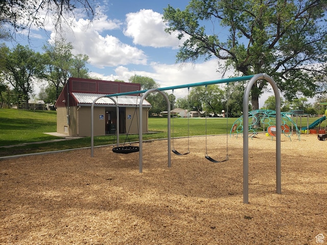 community jungle gym featuring a yard