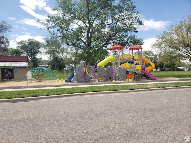 community play area featuring a lawn