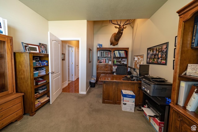 office space with carpet floors and baseboards