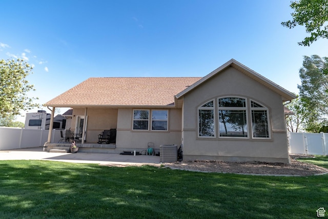 back of house featuring central air condition unit, stucco siding, and a patio
