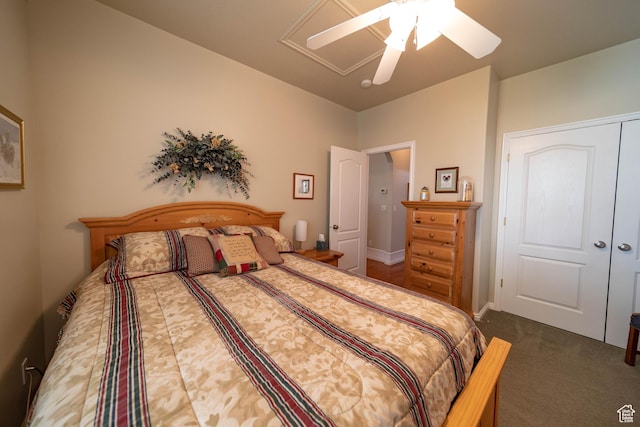 bedroom with ceiling fan, carpet, and a closet