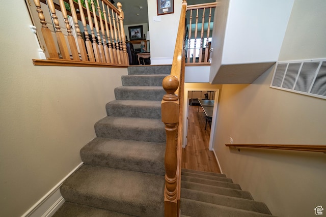 stairs featuring baseboards