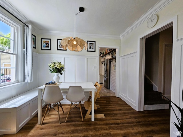44 S 700 E, Provo, UT 84606 - dining area featuring a decorative wall, plenty of natural light, ornamental molding, dark wood-style floors, and a wainscoted wall