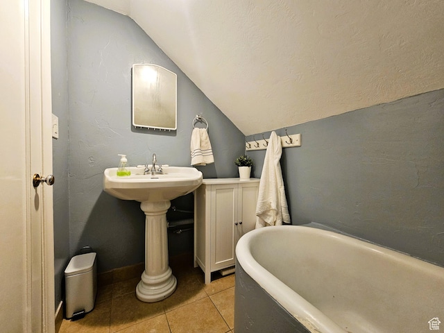 44 S 700 E, Provo, UT 84606 - bathroom featuring vaulted ceiling, a freestanding tub, and tile patterned floors