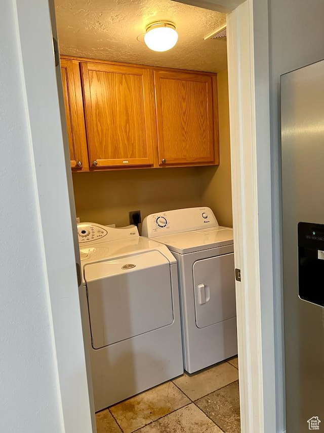 1347 S 1370 E, Provo, UT 84606 - laundry room with separate washer and dryer, cabinet space, and a textured ceiling