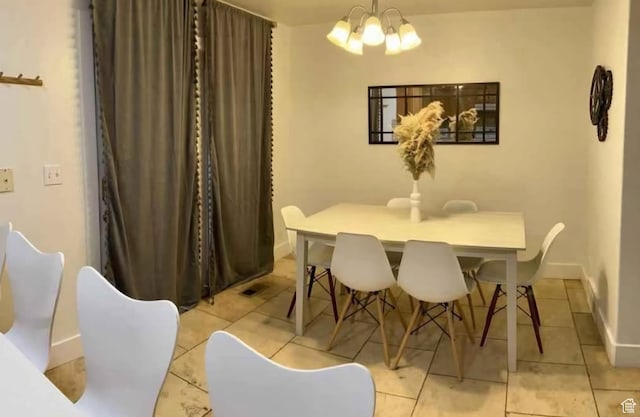 1347 S 1370 E, Provo, UT 84606 - dining area with a chandelier, light tile patterned floors, and baseboards