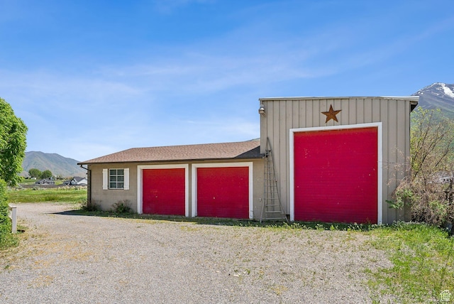 view of outbuilding with a mountain view