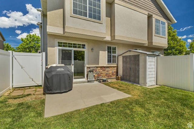 6297 W Traveler Ln, West Jordan, UT 84081 - rear view of house featuring stucco siding, a storage shed, a gate, an outbuilding, and a patio