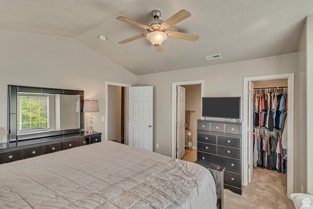 6297 W Traveler Ln, West Jordan, UT 84081 - carpeted bedroom with a walk in closet, a closet, lofted ceiling, ensuite bathroom, and ceiling fan