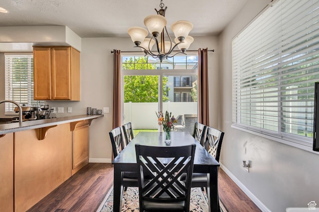 6297 W Traveler Ln, West Jordan, UT 84081 - dining area with dark wood-style flooring and healthy amount of natural light