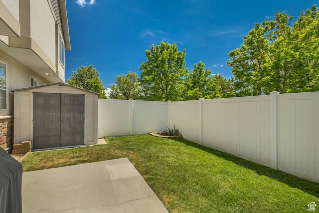 6297 W Traveler Ln, West Jordan, UT 84081 - view of yard with a storage shed, a patio area, and an outdoor structure