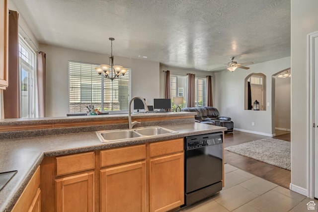 6297 W Traveler Ln, West Jordan, UT 84081 - kitchen featuring dishwasher, a sink, a chandelier, open floor plan, and a textured ceiling