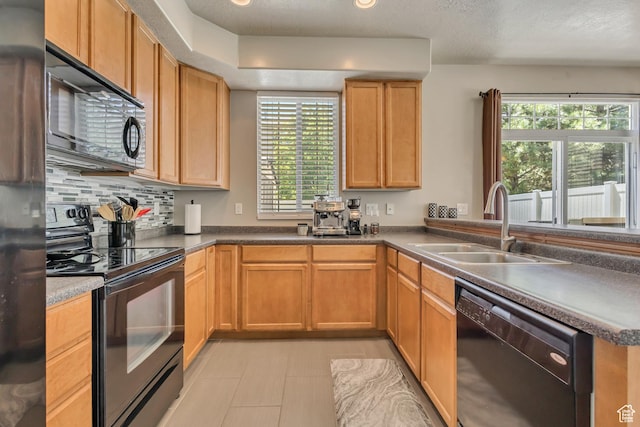 6297 W Traveler Ln, West Jordan, UT 84081 - kitchen featuring black appliances, a sink, backsplash, and light tile patterned flooring