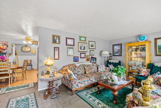 7472 S Silver Cir, West Jordan, UT 84084 - carpeted living area with a textured ceiling and a ceiling fan