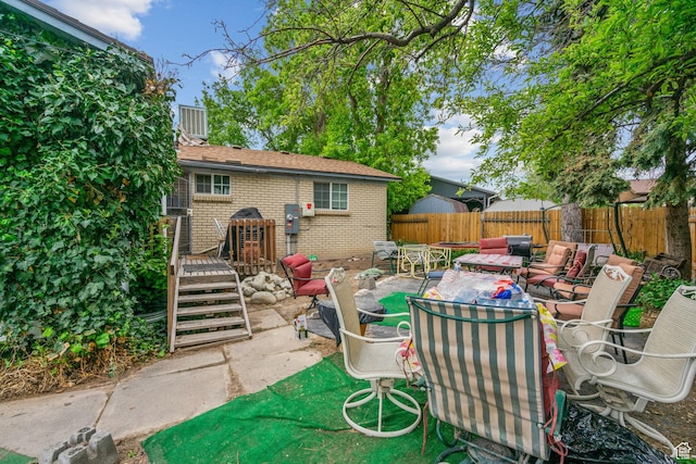 7472 S Silver Cir, West Jordan, UT 84084 - view of patio / terrace featuring a fenced backyard and outdoor lounge area