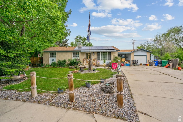7472 S Silver Cir, West Jordan, UT 84084 - ranch-style home featuring driveway, brick siding, a garage, and roof mounted solar panels