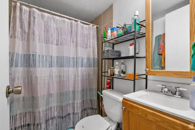 7472 S Silver Cir, West Jordan, UT 84084 - bathroom with toilet, vanity, and curtained shower