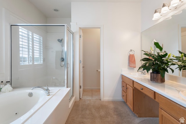 bathroom featuring a stall shower, a garden tub, and double vanity