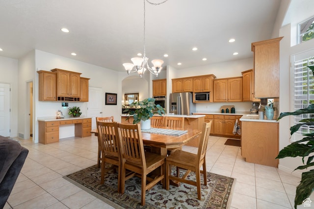dining space featuring recessed lighting, light tile patterned floors, a chandelier, and arched walkways