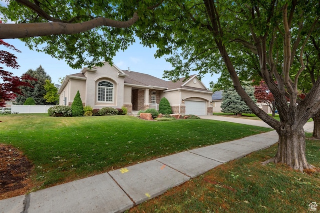 view of front of house with stucco siding, concrete driveway, an attached garage, and stone siding