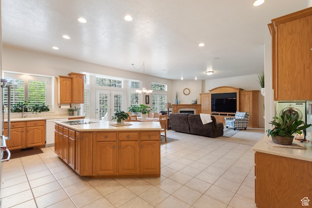 kitchen with recessed lighting, light countertops, light tile patterned flooring, and black electric cooktop