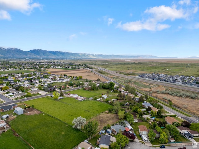 aerial view of residential area featuring a mountainous background