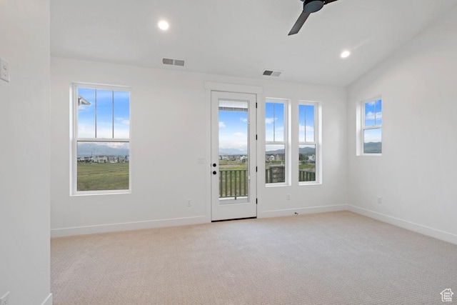 unfurnished room with light carpet, baseboards, ceiling fan, and recessed lighting
