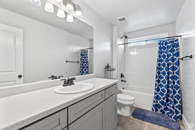 full bath featuring vanity, toilet, tile patterned floors, and shower / bath combo with shower curtain