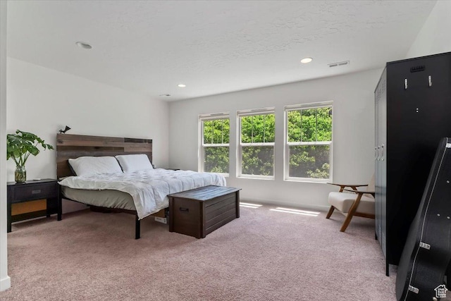 bedroom with carpet flooring and recessed lighting