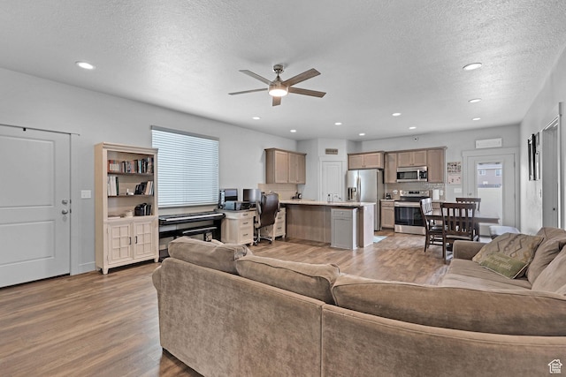 200 W 1200 S Unit 18, Tremonton, UT 84337 - living area with light wood finished floors, a ceiling fan, an office area, a textured ceiling, and recessed lighting