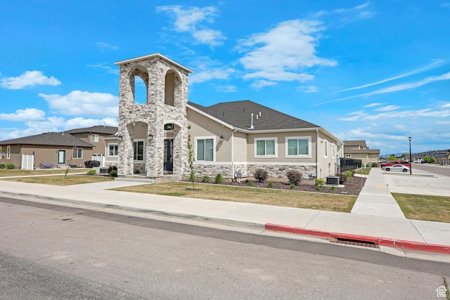 200 W 1200 S Unit 18, Tremonton, UT 84337 - view of front facade with stucco siding, stone siding, and central AC