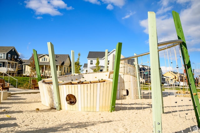 view of play area with a residential view
